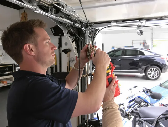 Wilmington Island Garage Door Repair safety certified technician performing cable replacement in Wilmington Island